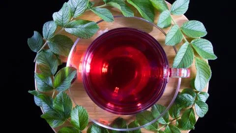 Tea time: cup of tea. Creative layout made of cup of hibiscus tea and tea lea Foto stock