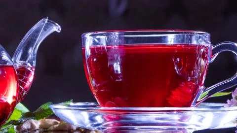 Tea time: cup of tea. Creative layout made of cup of hibiscus tea and tea lea Stock Photos
