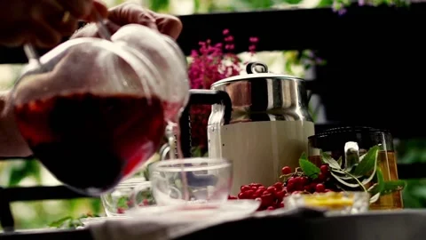 Tea time: hand pouring a cup of tea on the balcony, 120fpsTea time: hand pouring Stock Footage 118836813