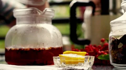 Tea time: hand pouring water to teapot on the balcony, 120fps Stock Footage 118837404