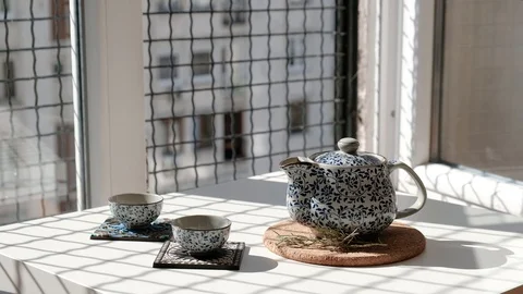 Tea time at home next to open window on a sunny afternoon. Stock-Footage 130153123