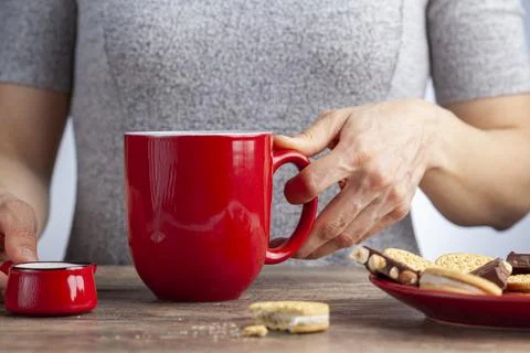 A tea time or coffee time concept with sandwich cookies, bars of chocolate ae Stock Photos