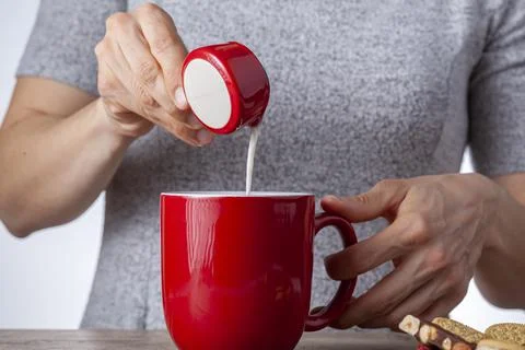 A tea time or coffee time concept with sandwich cookies, bars of chocolate ae Stock Photos