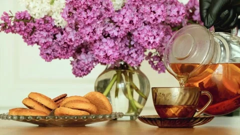 Tea-Time Setting Bouquet Purple White Lilac Flowers Tabletop Presentation 4K Stock Footage 337512445