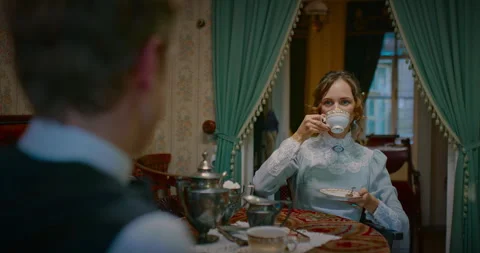 Tea time in vintage interior in 19th century, portrait of beautiful woman, 4K Stock Footage 257960117