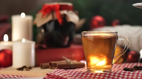 Tea in a white mug with a spoon stir the sugar Christmas with slow motion Stock Footage 56557601