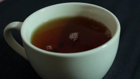 Tea in a white mug. White mug close up. Stock Footage 300488800