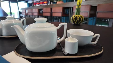 Tea in the white teapot setting. Stock Footage 317628446