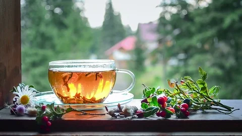 Tea on the window sill. Hot tea. Tea leaves at the bottom of the cup. Tea time. Stock Footage 74949871