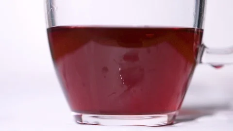 Teabag Drop in Cup  at 1500fps Stock Footage 104848804