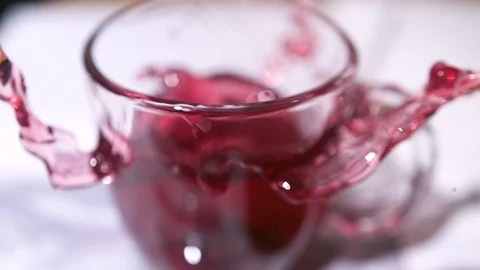 Teabag Drop in Cup  at 1500fps High Shot Stock Footage 104848605