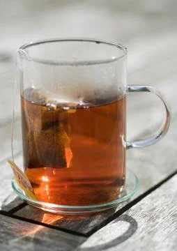 Teabag steeping in mug Stock Photos