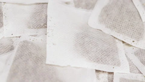 Teabags slowly rotating, macro closeup Stock Footage 132641676
