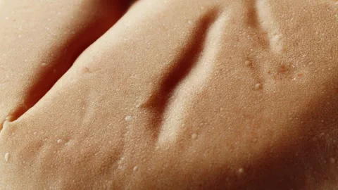 Teacake bread bun roll extreme macro close up with a rotating camera motion.. Stock Footage 328701356