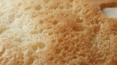 Teacake bread bun roll extreme macro close up with a rotating camera motion.. Stock Footage 328701365