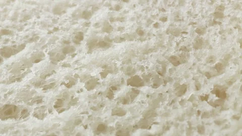 Teacake bread bun roll extreme macro close up with a rotating camera motion.. Stock Footage 328701702