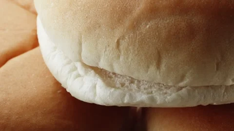Teacake bread bun roll extreme macro close up with a rotating camera motion.. Vídeo Stock 328701711
