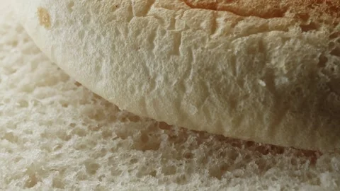 Teacake bread bun roll extreme macro close up with a rotating camera motion.. Vídeo Stock 328701784