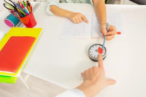 Teach point child to lesson timer with finger Stock Photos