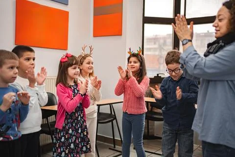 Teacher and elementary students at language school class Stock Photos