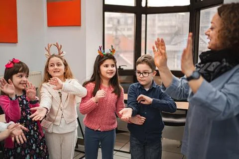 Teacher and elementary students at language school class Stock Photos