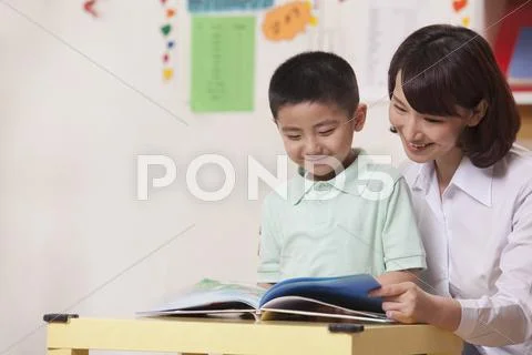 Teacher and Student Reading Stock Photos