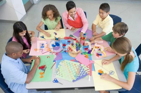 Teacher and students in art class Stock Photos