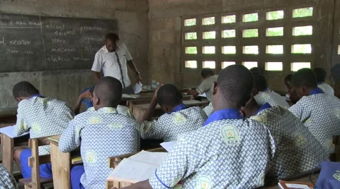 TEACHER AND STUDENTS IN CLASSROOM Stock Footage 60116014