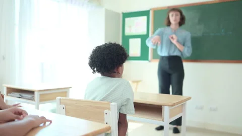 Teacher and students, Learn and study in a classroom of school Stock Footage 282773524
