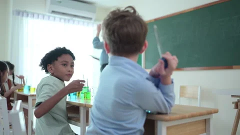 Teacher and students, Learn and experiment with science Stock Footage 285303547