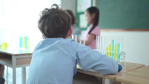 Teacher and students, Learn and experiment with science Stock Footage 285308850