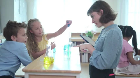 Teacher and students, Learn and experiment with science Stock Footage 285312013