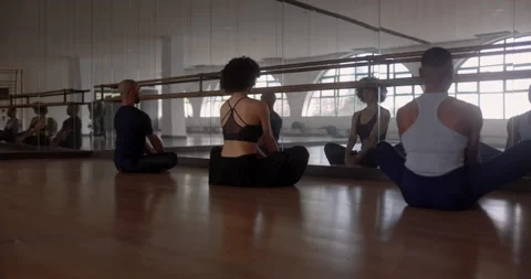 Teacher and students meditating in studio Stock Footage 147354739