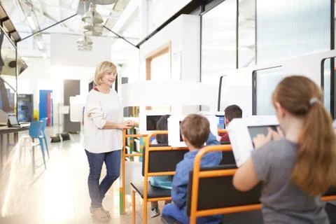 Teacher and students using touch screen computers Stock Photos