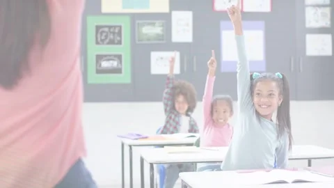 Teacher asking question and gesturing, students raising hands to answer in Stock Footage 333733454
