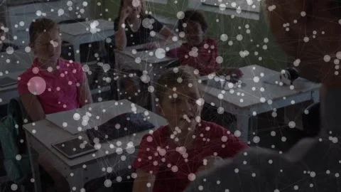Teacher asking question in classroom and boy in red polo raising hand then Stock Footage 328715691