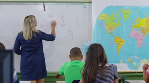 Teacher asks students math questions in school classroom Stock Footage 68962700