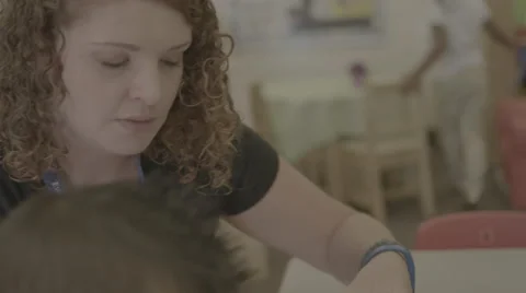 Teacher assisting student Stock Footage 62824140