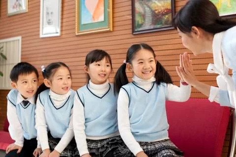 Teacher bonding with her students Stock Photos