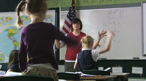 Teacher calming down her class Stock Footage 12008291