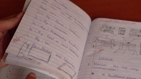 Teacher checking the grades and exam results of students in rural school, Africa Stock Footage 230078663