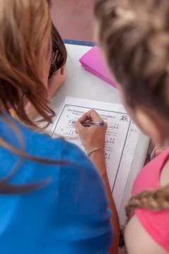 The teacher checking the homework Stock-Fotos