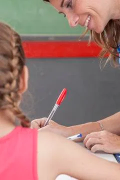 The teacher checking the homework Stock Photos