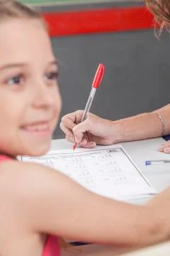 The teacher checking the homework Stock-Fotos