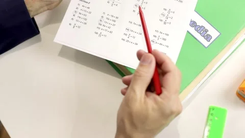 The teacher checks the math test. Stock Footage 160035751