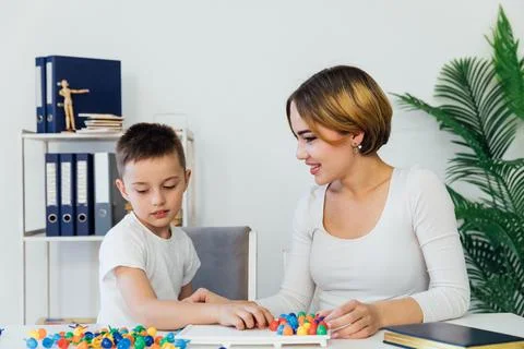 Teacher in classes with a boy in school development training Stock Photos