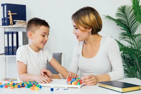 Teacher in classes with a boy in school development training Stock Photos