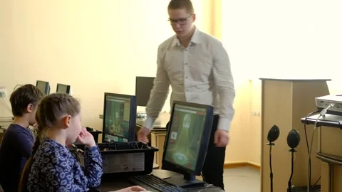 Teacher with computer takes a math class 4k Stock Footage 74289456