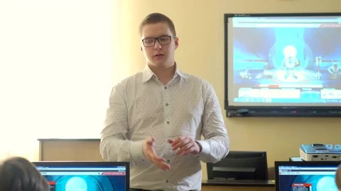 Teacher with computer takes a math class 4k Stock Footage 74289725