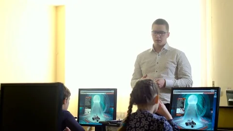 Teacher with computer takes a math class 4k Stock Footage 74290032